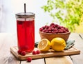 Ice cold drink glass with raspberry and lemon cocktail . Royalty Free Stock Photo