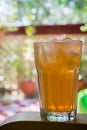 Ice cold drink on a hot summer day, sunny balcony in the background Royalty Free Stock Photo