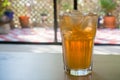 Ice cold drink on a hot summer day, sunny balcony in the background Royalty Free Stock Photo