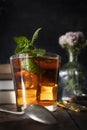 Ice cold mint tea with ounces of dark chocolate. Summer plans for a quiet afternoon