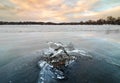 Ice composition at frozen lake Beloye in winter with a sunset background Royalty Free Stock Photo