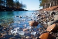 Ice-covered rocks along a shoreline photo - stock photography concepts