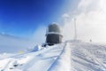 Ice-covered screen weather station, high on mountain-top Royalty Free Stock Photo