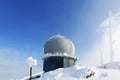 Ice-covered screen weather station, high on mountain-top Royalty Free Stock Photo