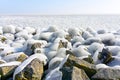 Ice covered stones under a blue sky Royalty Free Stock Photo