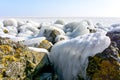 Ice covered stones under a blue sky Royalty Free Stock Photo