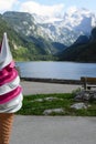 Ice Cream Advertising Mockup On The Background Of The Austrian Landscape. Lake, Mountains With Snow And Forests In The Gosau