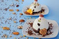 Ice cream background in the shape of two edible snowmen on white plates close up. Top view. Creative idea for Christmas. Royalty Free Stock Photo