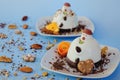 Ice cream background in the shape of two edible snowmen on white plates close up. Top view. Creative idea for Christmas. Royalty Free Stock Photo