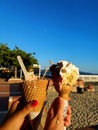 Ice cream on the beach with friend on a happy summer day Royalty Free Stock Photo