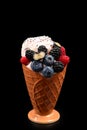 Ice cream with blueberries, blackberries and raspberries on a black background.  Copy space Royalty Free Stock Photo