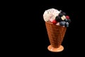 Ice cream with blueberries, blackberries and raspberries on a black background.  Copy space Royalty Free Stock Photo