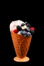 Ice cream with blueberries, blackberries and raspberries on a black background.  Copy space Royalty Free Stock Photo