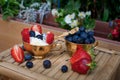 Ice cream with blueberries and strawberries in Golden Cup on table Royalty Free Stock Photo