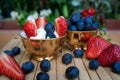 Ice cream with blueberries and strawberries in a Golden Cup on the table Royalty Free Stock Photo