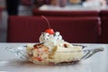 Ice cream in a boat plate decorated with banana and cherry Royalty Free Stock Photo