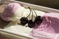 Ice cream box with three cherries Royalty Free Stock Photo