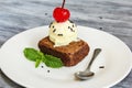 Ice cream and browny with cherry and mint Royalty Free Stock Photo