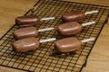 Ice cream cake with chocolate cream. Chocolate chip cookies on a stick in the form of ice cream on the table Royalty Free Stock Photo