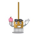 With ice cream cartoon rake leaves with wooden stick Royalty Free Stock Photo