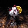 Ice cream with chocolate, cherry and orange in a crystal glass Royalty Free Stock Photo