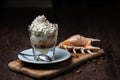 Ice cream with coffee, Affogato al Caffe Frappe with shell on the dark table.
