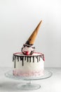 Ice cream cone birthday layer cake on a white background. Royalty Free Stock Photo