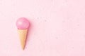 Ice cream cone & Christmas ornament on pastel pink minimal backg