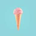 Ice cream cone close-up. Pink Icecream scoop in waffle cone over blue background. Strawberry or raspberry flavor Sweet dessert Royalty Free Stock Photo