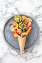 Ice cream cone with fresh fruits Royalty Free Stock Photo