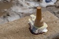 Ice cream cone has dropped upside down on the sidewalk on the ground Royalty Free Stock Photo