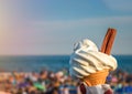 Ice cream cone held up to the hot summer sky Royalty Free Stock Photo