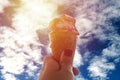 Ice cream cone held up to the hot summer sky. Royalty Free Stock Photo