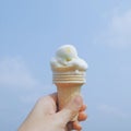 Ice-cream cone melting in a sunny day