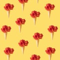 Ice cream cone with red tulip flowers pattern to yellow background. Minimal spring concept Royalty Free Stock Photo