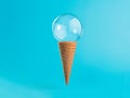 Ice cream cone with soap bubble on blue background
