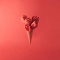 Ice cream cone with tulip flowers. Minimal spring concept. Flat lay. Monochromatic red Royalty Free Stock Photo