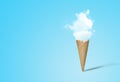 Ice cream cone with white cloud in blue background. Royalty Free Stock Photo
