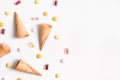 Ice cream cones and candy lay flat image with copy space
