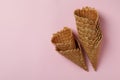 Ice cream cones on pink background, space for text Royalty Free Stock Photo