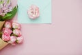 Ice cream cones with pink flowers and mint envelope on pink pastel background Royalty Free Stock Photo