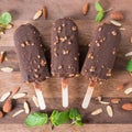 Ice cream covered with chocolate and almonds sticks. Top view. Royalty Free Stock Photo