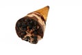 Ice cream of creamy cocoa chocolate cone with topping of chocolate sauce and brownie pieces in a crispy wafer cones, melting cold