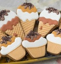 Ice-cream and cupcake cookies on a wooden table