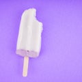 Ice cream flavor taro wooden stick on purple paper background.Copy space your text Royalty Free Stock Photo