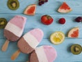 Ice cream fruits dessert flavor on a blue wooden background, grapefruit, lemon, kiwi, pattern, strawberry Royalty Free Stock Photo
