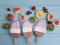 Ice cream fruits milk dessert natural flavor on a blue wooden background, grapefruit, lemon, kiwi, pattern, strawberry Royalty Free Stock Photo