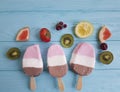 Ice cream summer fruits dessert fresh natural flavor on a blue wooden background, grapefruit, lemon, kiwi, pattern, strawberry Royalty Free Stock Photo