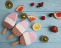 Ice cream fruits on a blue wooden background, grapefruit, lemon, kiwi, pattern, strawberry Royalty Free Stock Photo