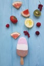 Ice cream summer milk dessert fresh cream flavor on a blue wooden background, grapefruit, lemon, kiwi, pattern, strawberry Royalty Free Stock Photo